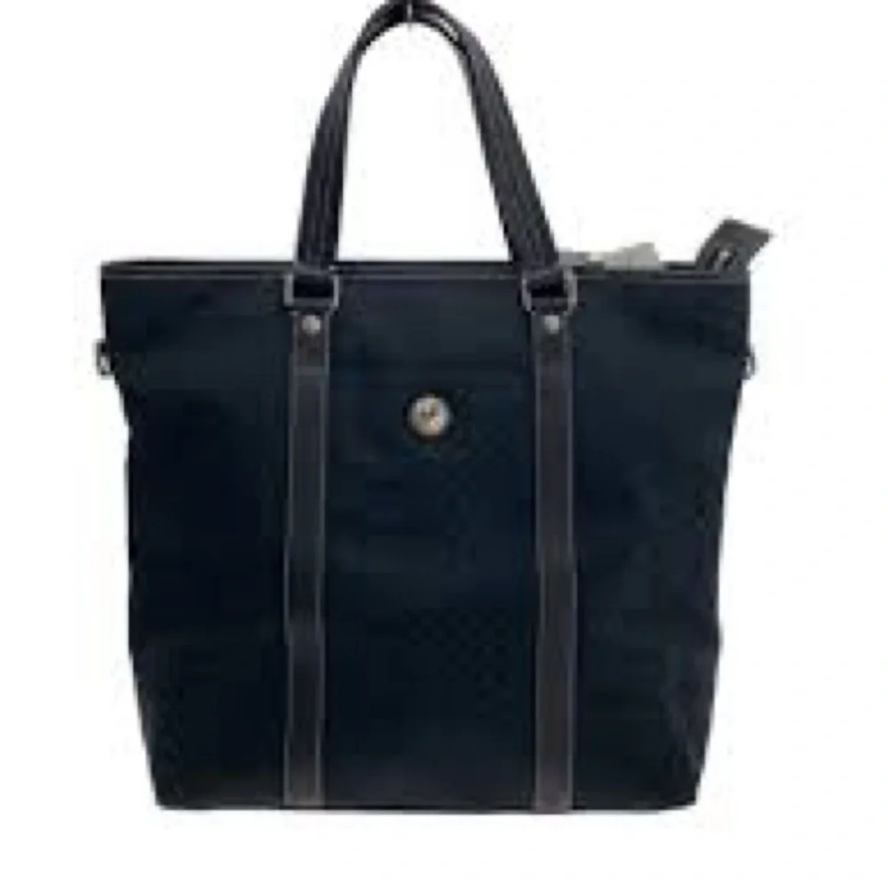 Coach travel Signature tote black featuring monogram canvas and leather 2009